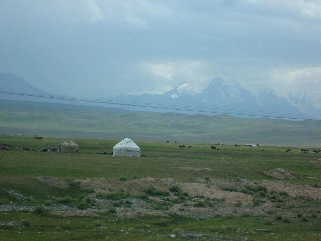 A yurt and rural landscape in Alay, Kyrgyzstan.