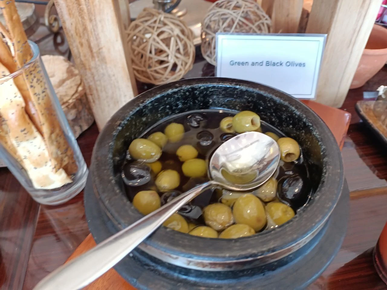 Green and black olives; a modern ingredient photograph.