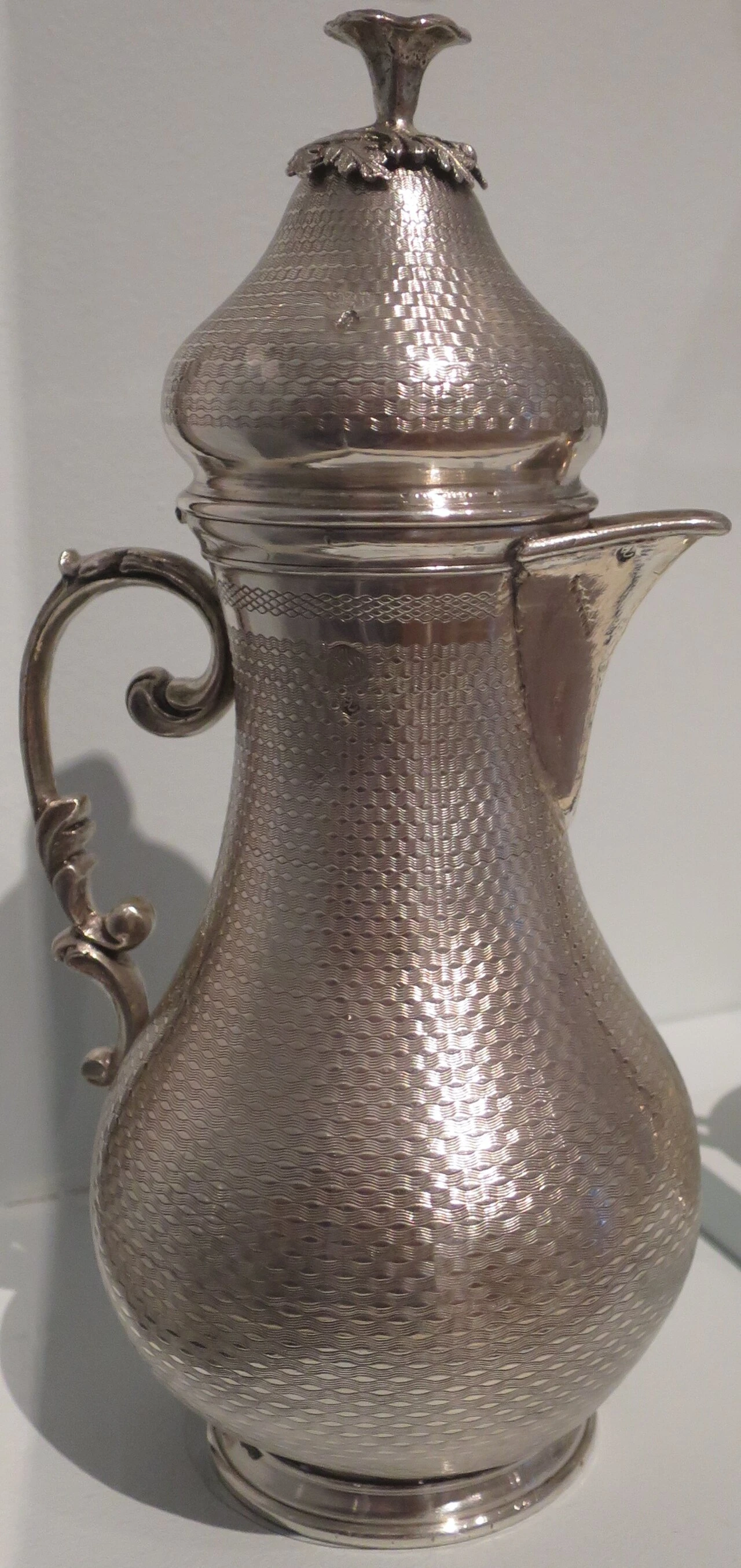 A nineteenth-century silver coffee pot from Turkey, a museum object.