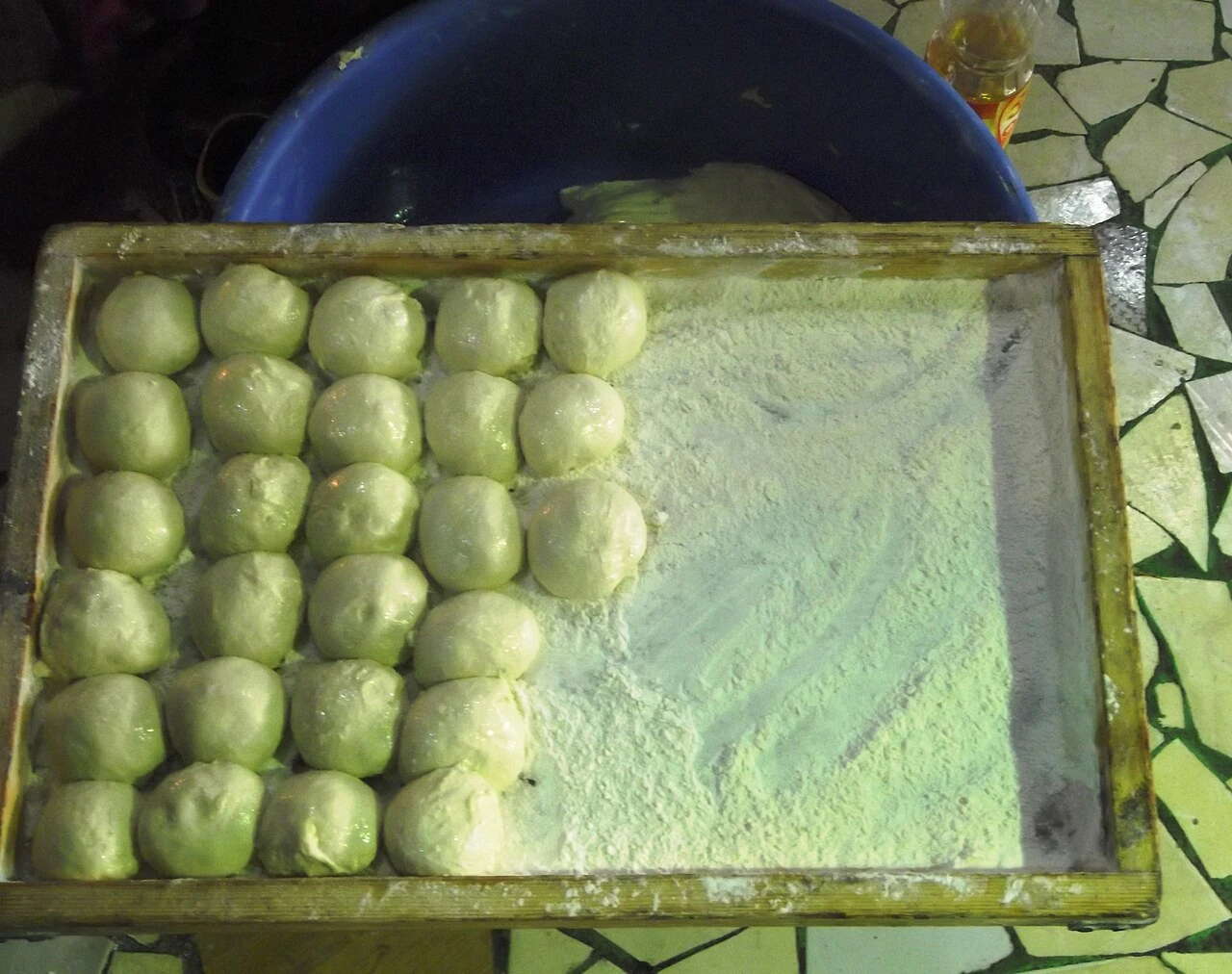 Preparing yufka: dough portions waiting to be rolled.
