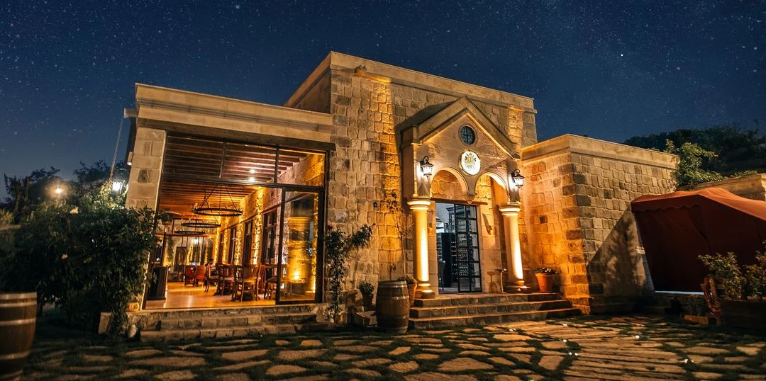 Illuminated entrance to Tasula Restaurant, Seraphim Cave Hotel