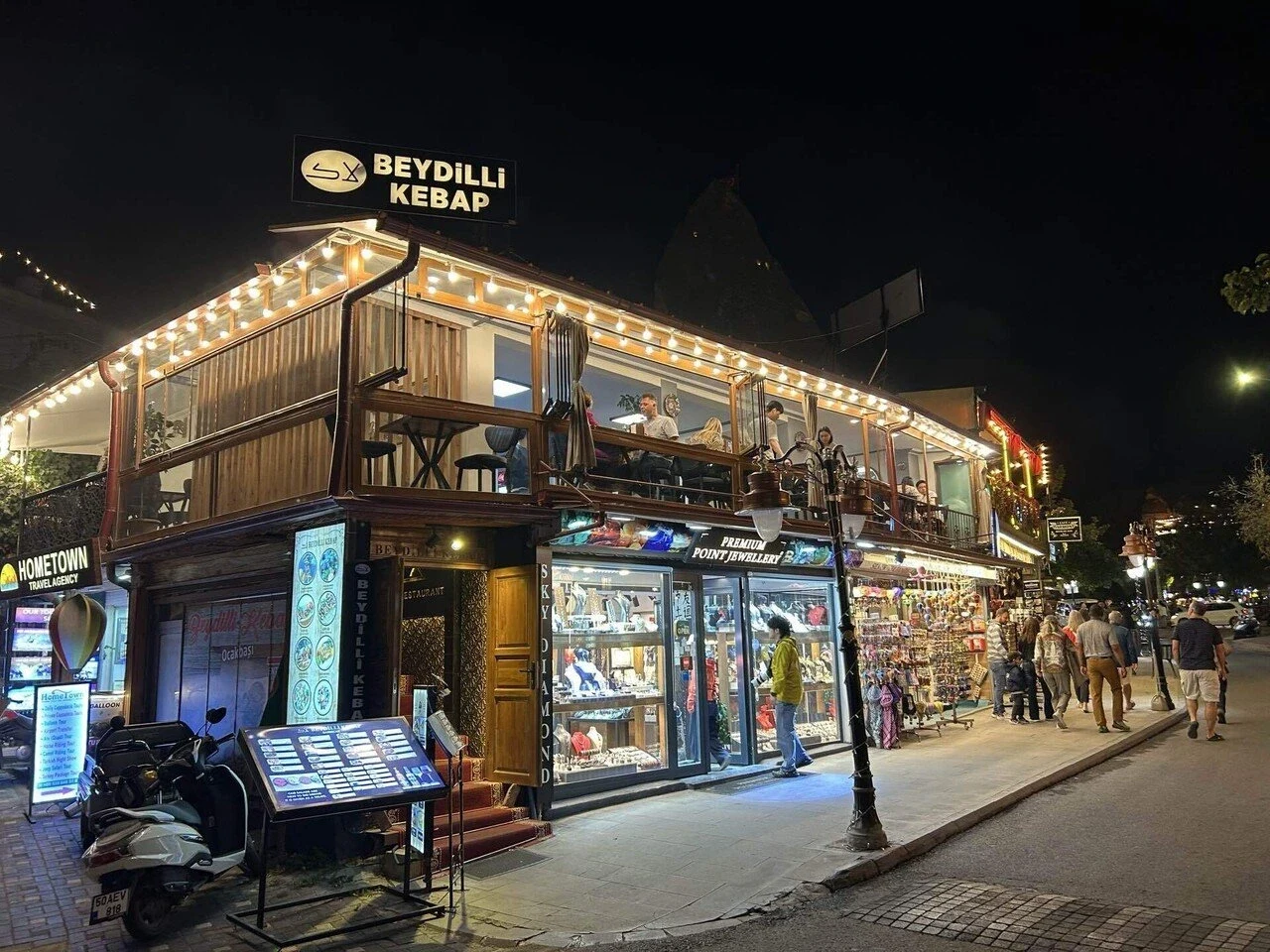Illuminated restaurant facade and upstairs terrace at Beydilli Kebab Steak, Göreme