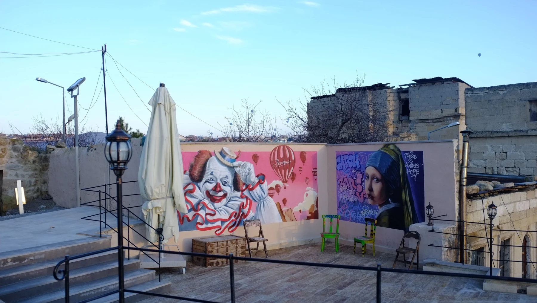 Cafe terrace with colourful murals at Barrus Coffee & Breakfast, Ortahisar
