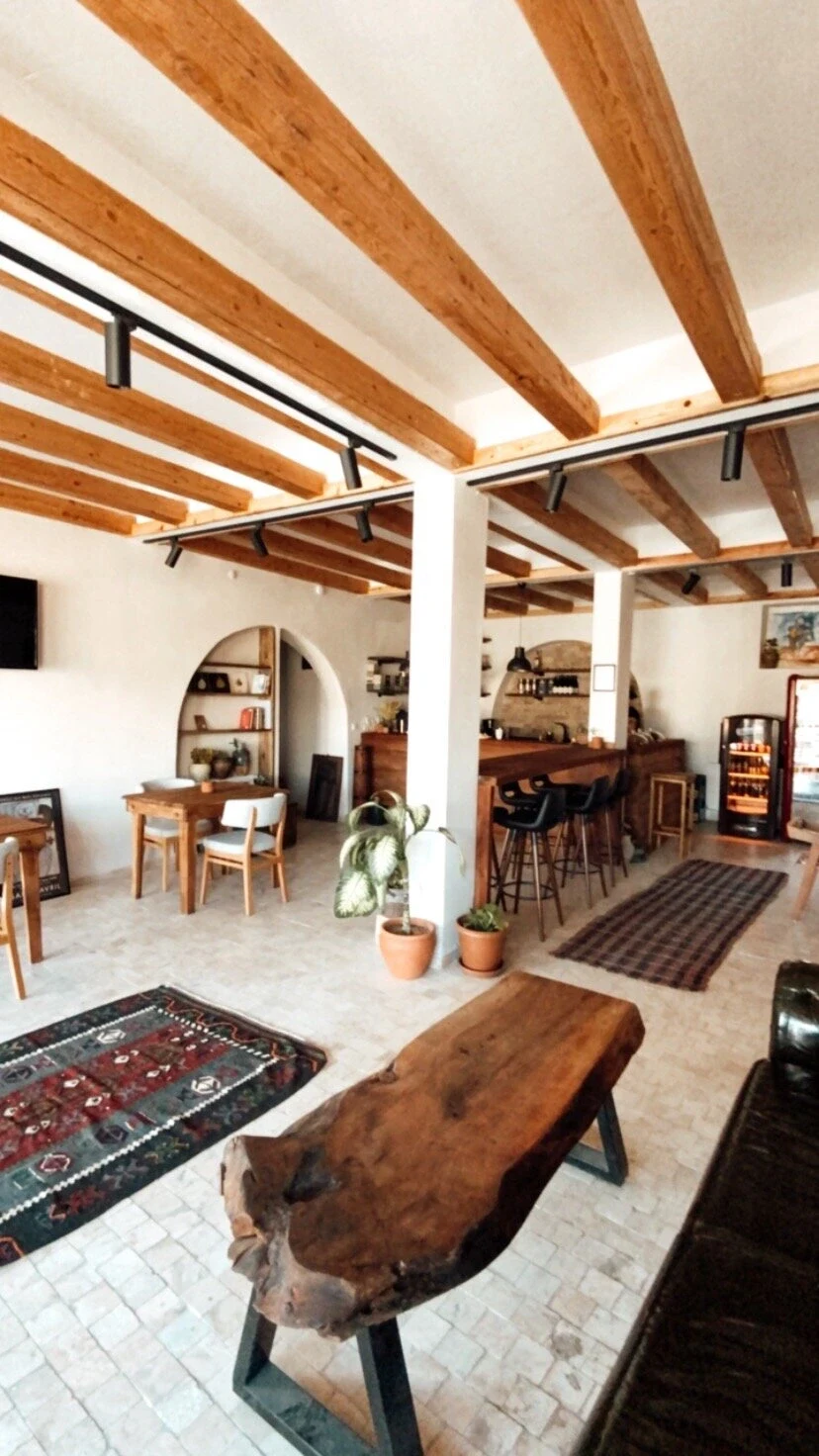 Cafe interior with wooden tables at Coffee Cubby Cappadocia, Uçhisar