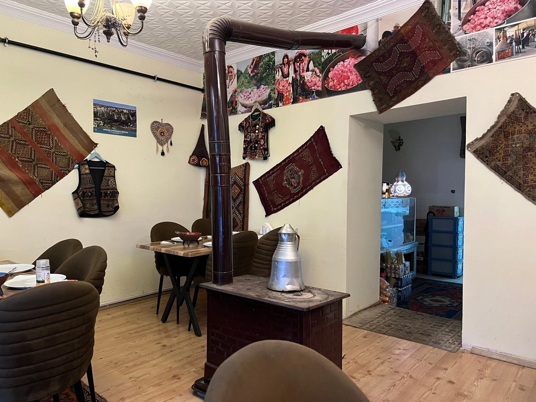 Stove and traditional textiles inside House Of Memories in Uçhisar