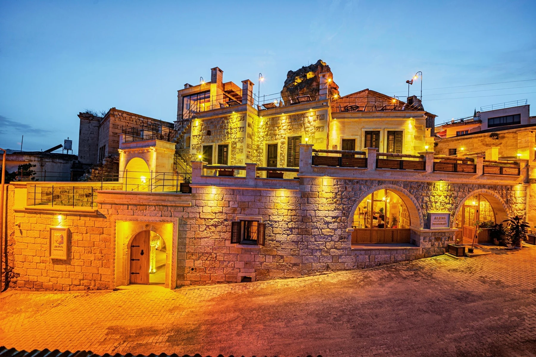 Janus Cappadocia Restaurant — Janus restaurant exterior at dusk