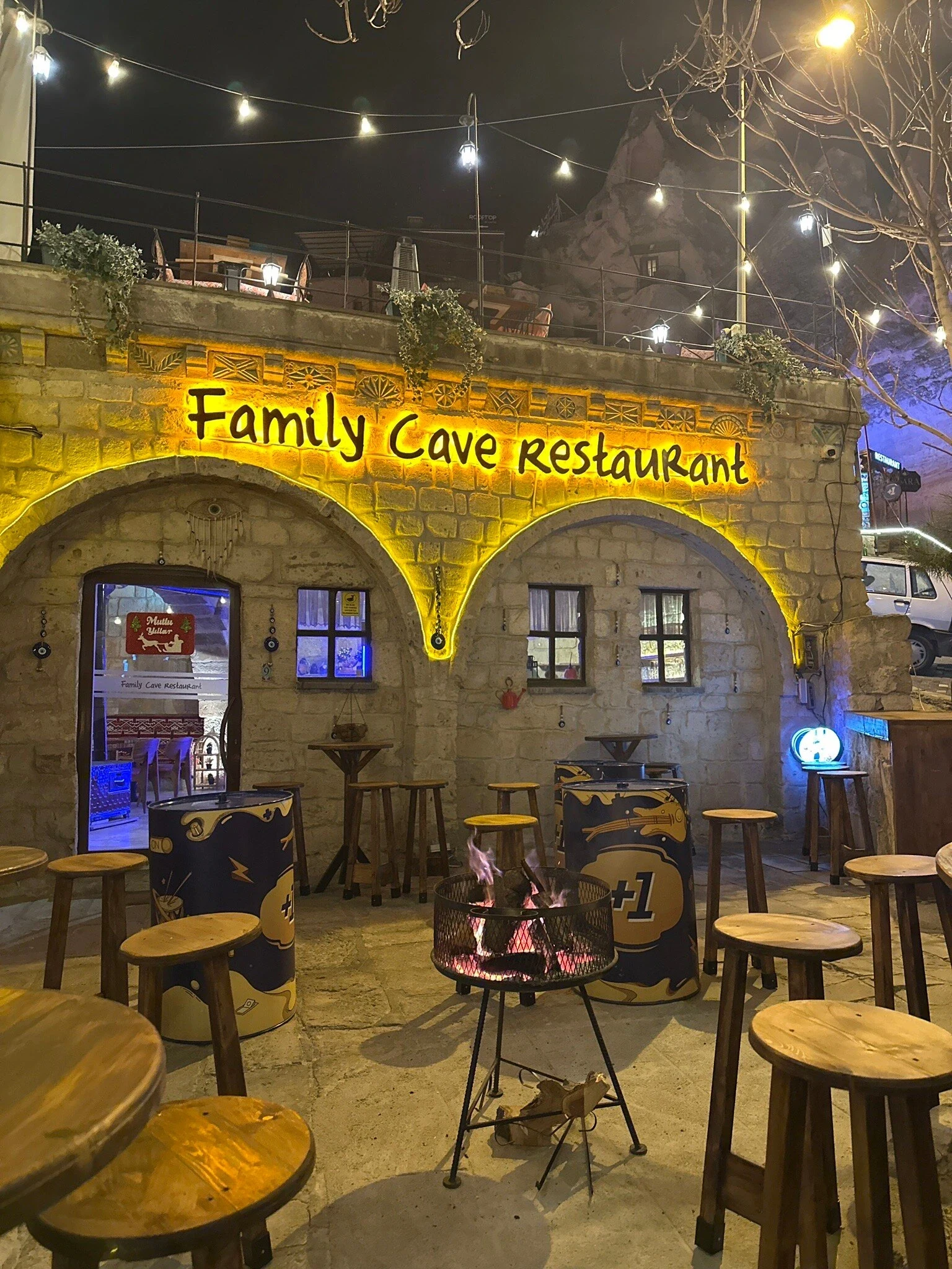 Family Cave Restaurant in Göreme — illuminated terrace and cave façade