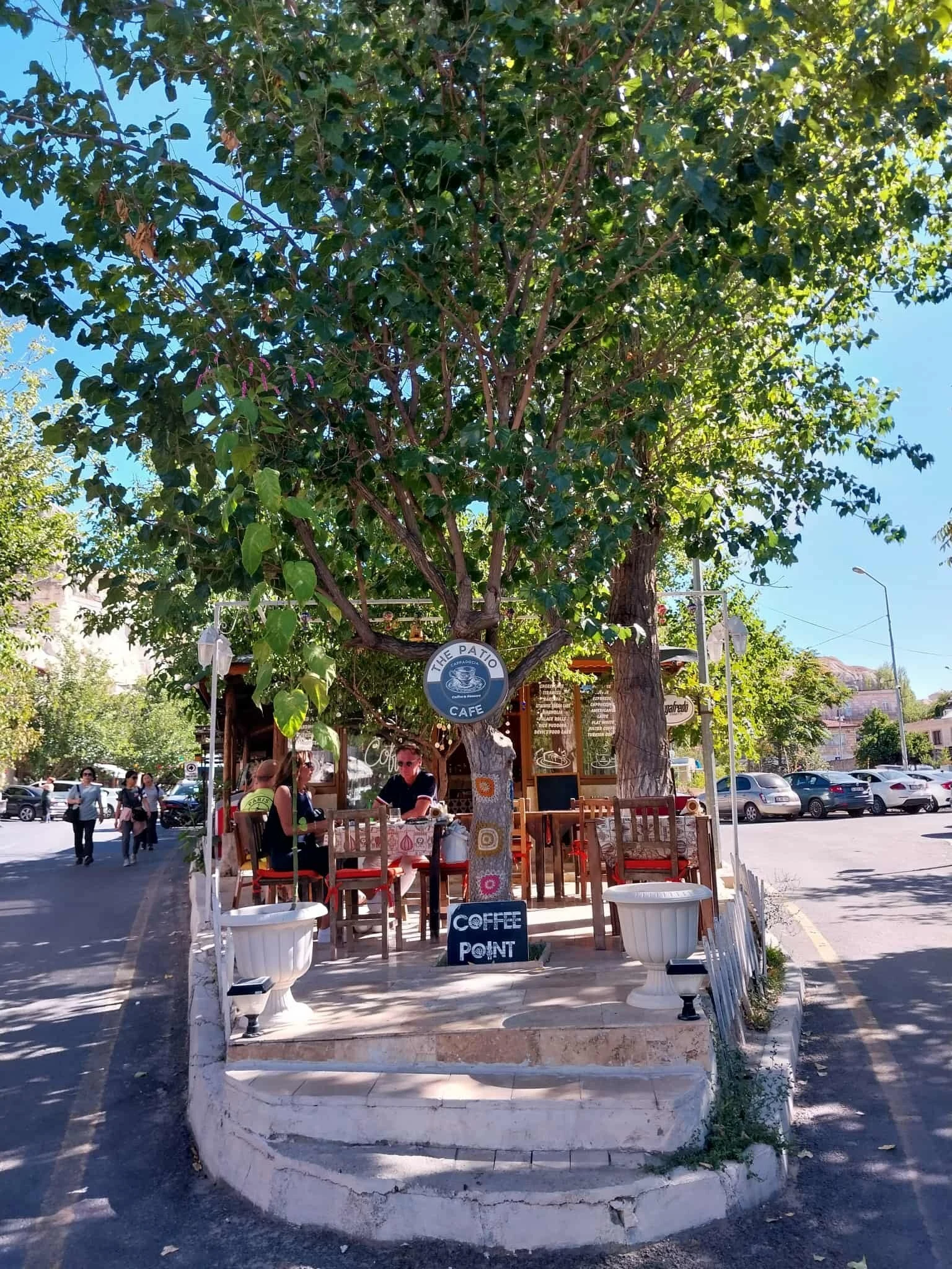 Tree-shaded entrance and garden at The Patio Cappadocia Cafe