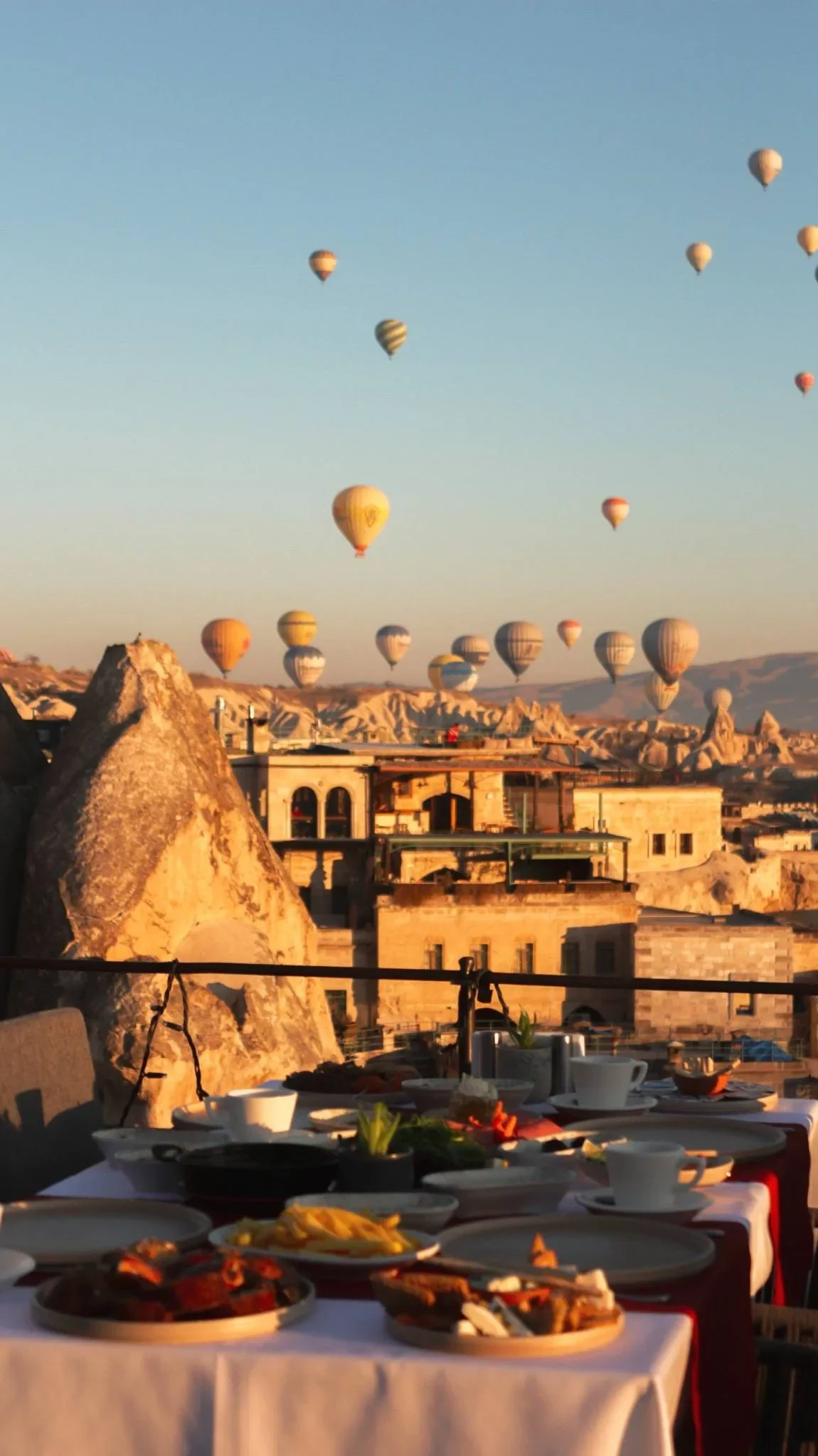 Veranda Rooftop in Göreme — rooftop dining terrace with balloons over Göreme