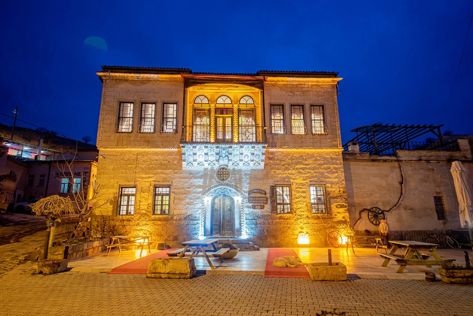 Old Greek House illuminated historic exterior at blue hour