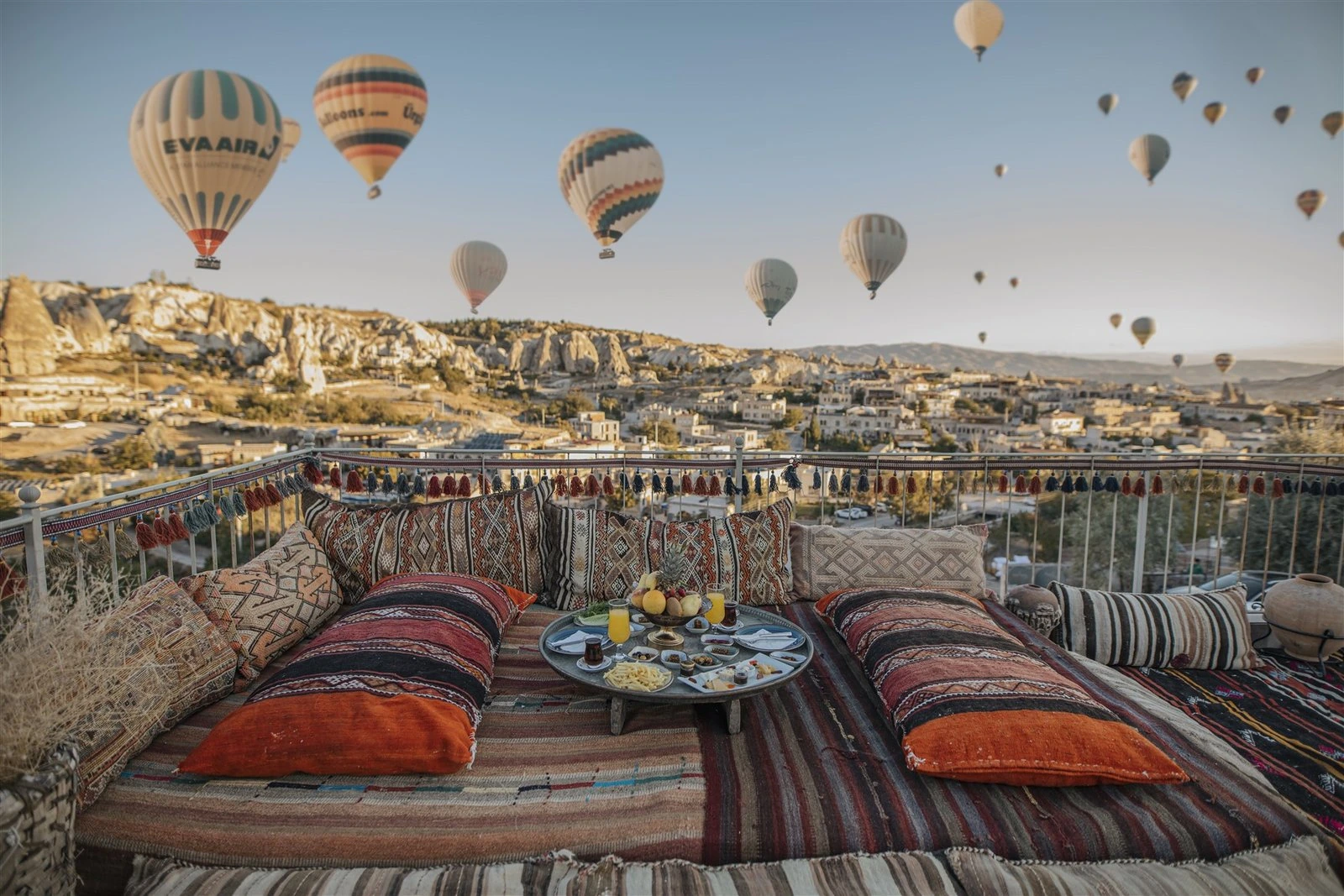 Uzundere terrace overlooking Göreme with hot-air balloons