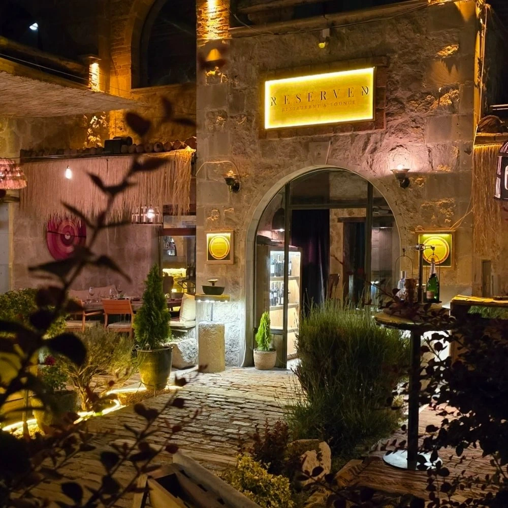 Reserved stone courtyard entrance at night