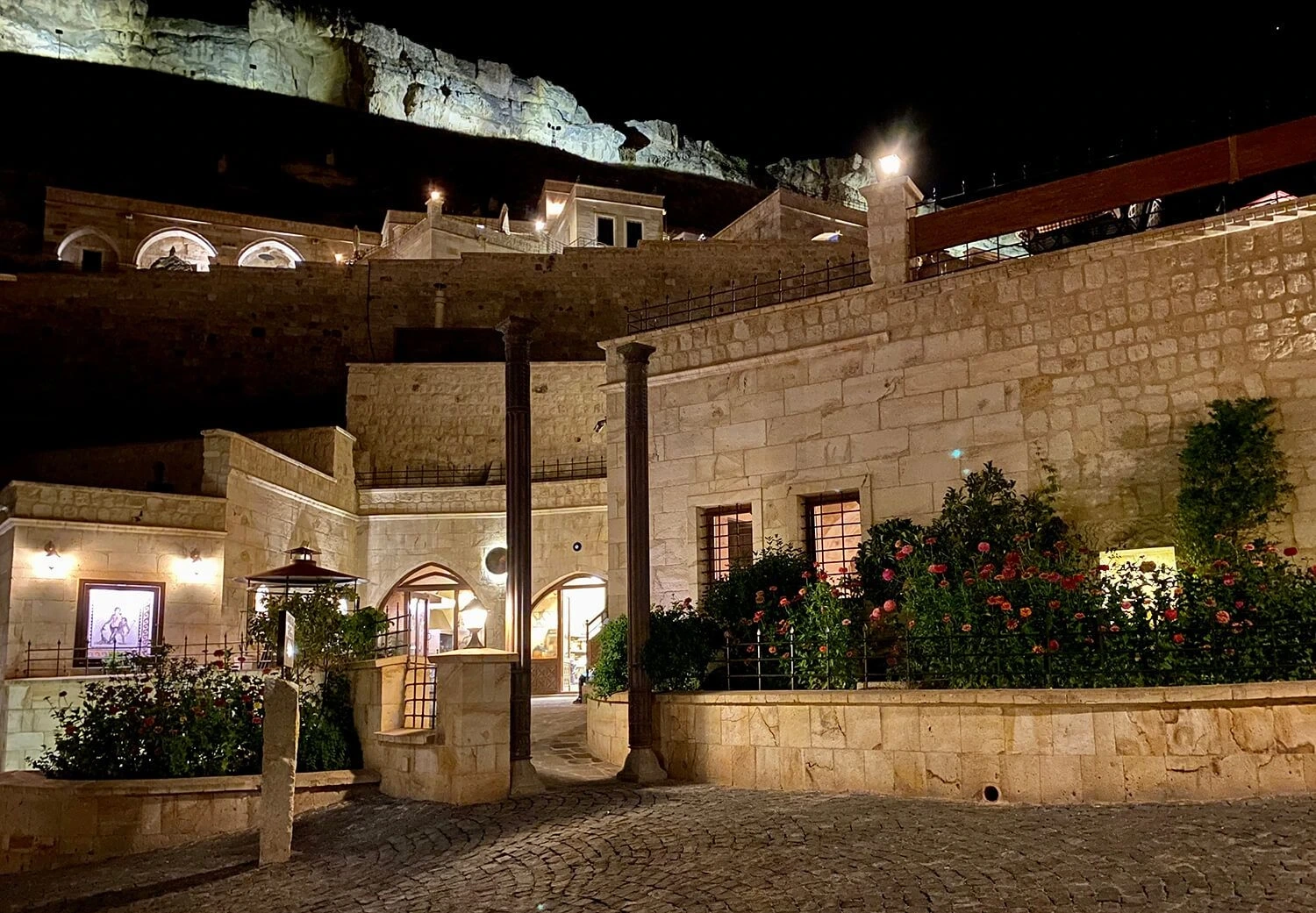 Revithia stone entrance and courtyard after dusk